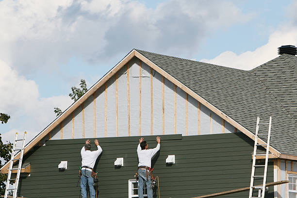 Professional Storm Damage Siding Repair technician working in Round Rock, TX